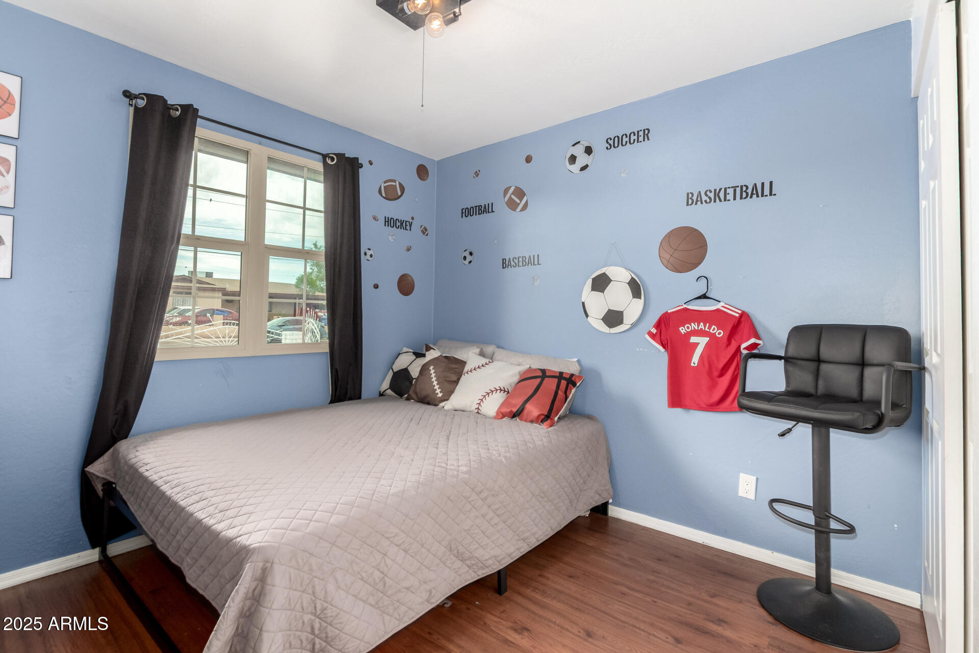 2024 West Roeser Road Phoenix, AZ 85041 - Photo 25 of 36 a bedroom with a bed and a window
