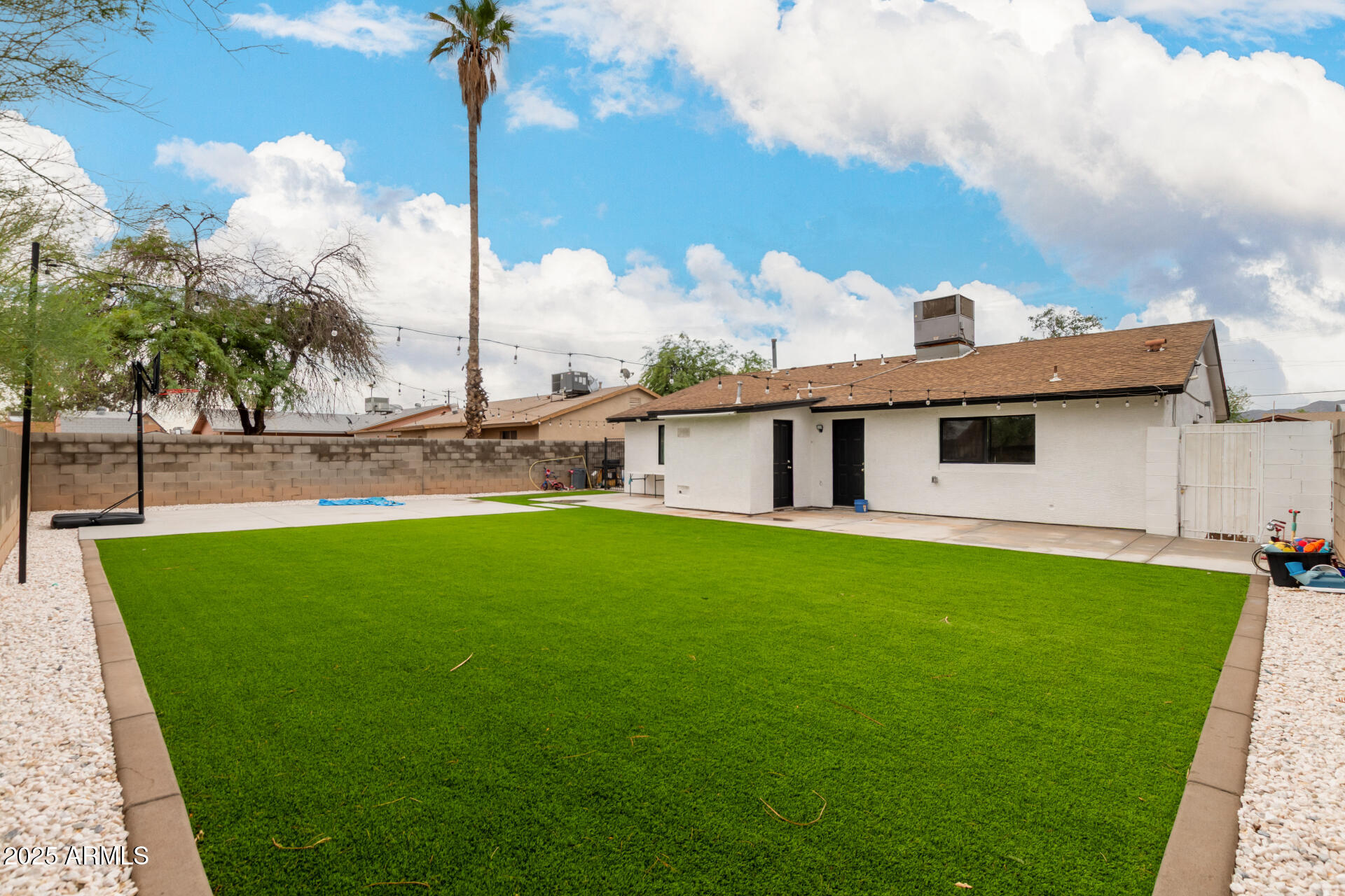 2024 West Roeser Road Phoenix, AZ 85041 - Photo 31 of 36 a front view of a house with garden