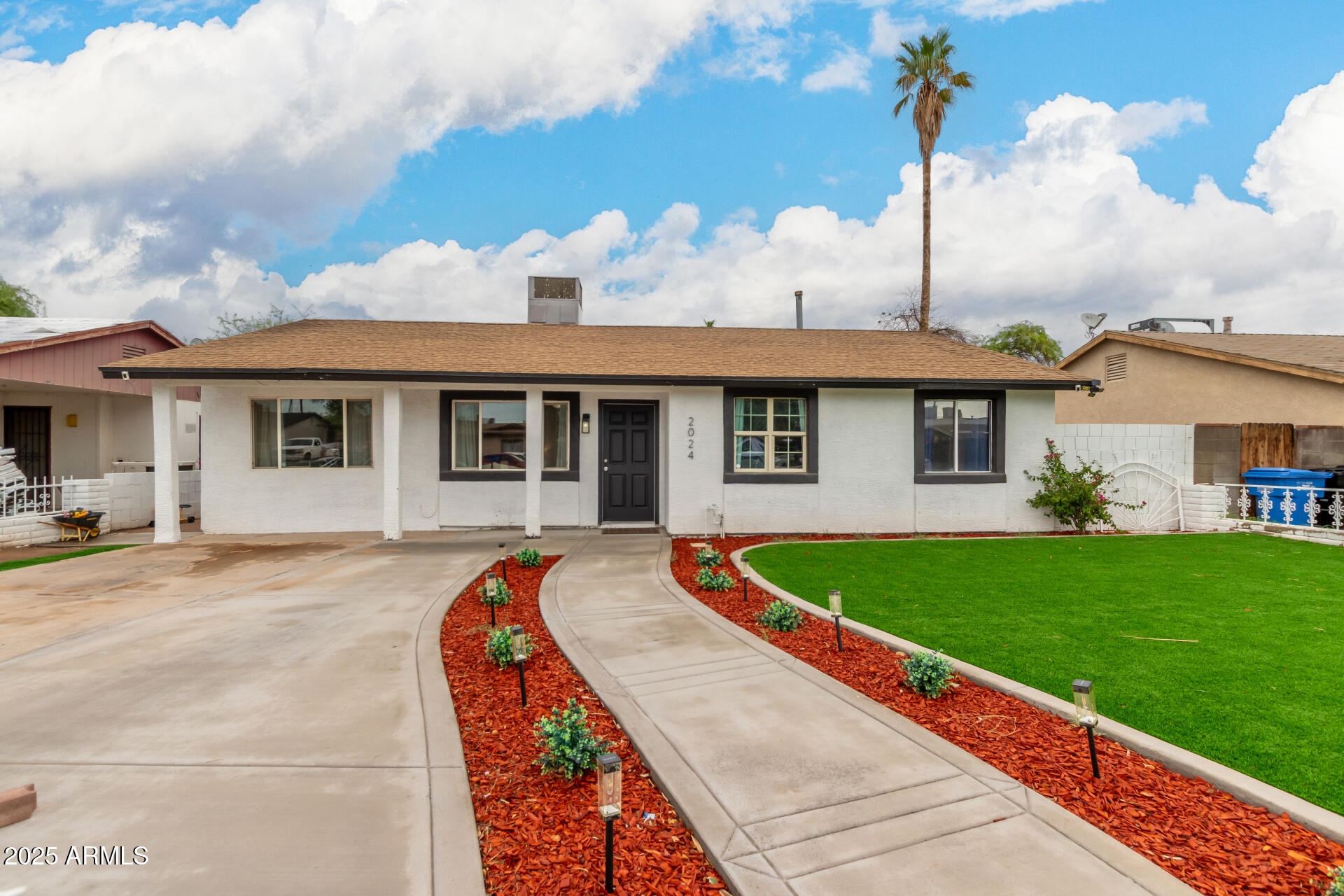 2024 West Roeser Road Phoenix, AZ 85041 - Photo 5 of 36 a front view of a house with garden