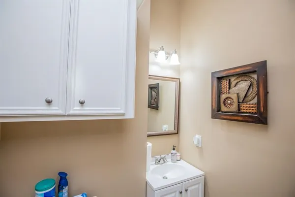 a bathroom with a sink and a mirror