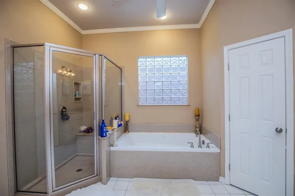 a bathroom with a double vanity sink mirror and shower