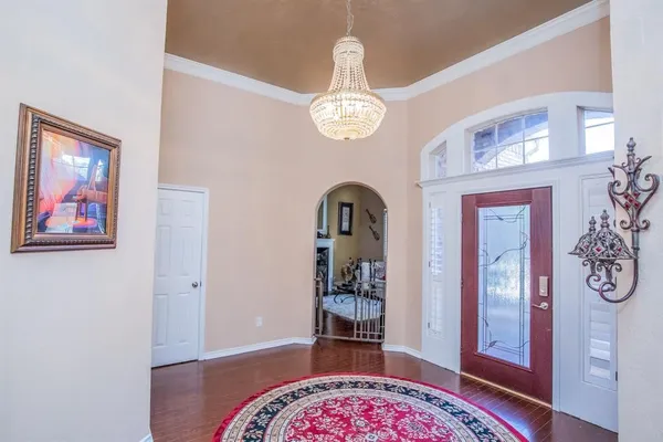 a view of an entryway with wooden floor