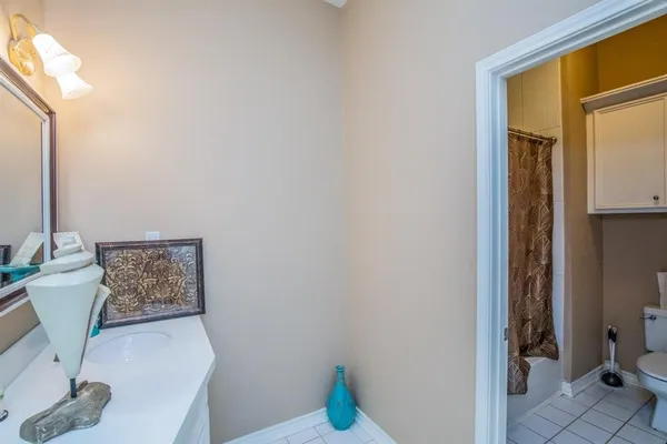 a view of patio with table and chairs and potted plants