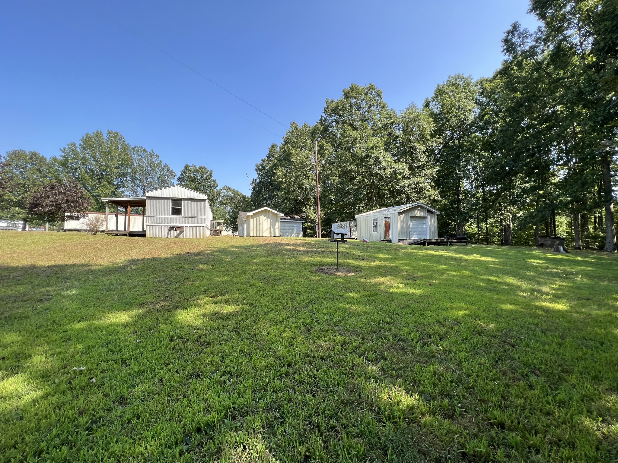 274 Running Meadows Road Portland, TN 37148 - Photo 18 of 24 a view of a house with a big yard