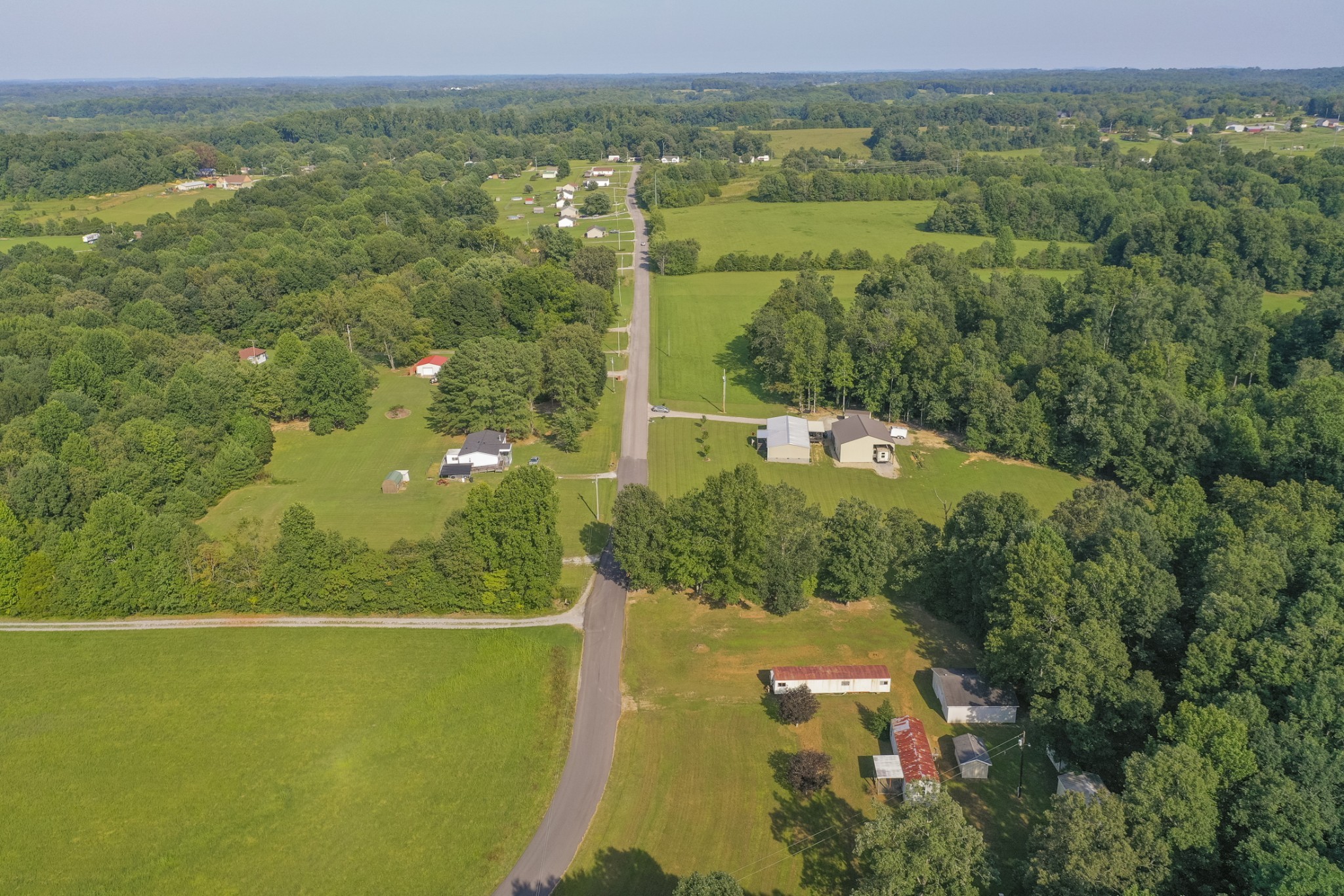 274 Running Meadows Road Portland, TN 37148 - Photo 5 of 24 a view of a lake with a yard