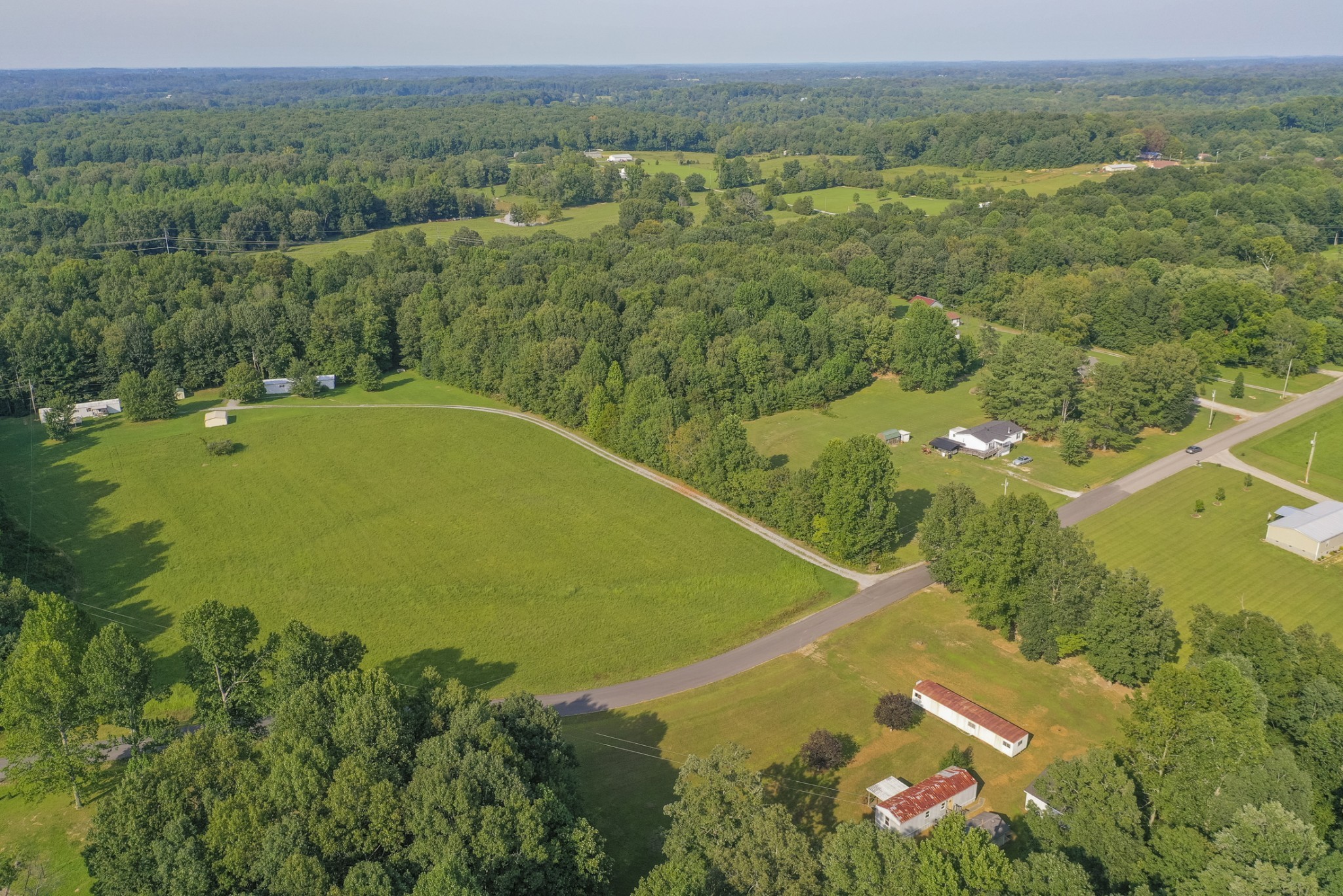274 Running Meadows Road Portland, TN 37148 - Photo 6 of 24 a view of a lake with a yard