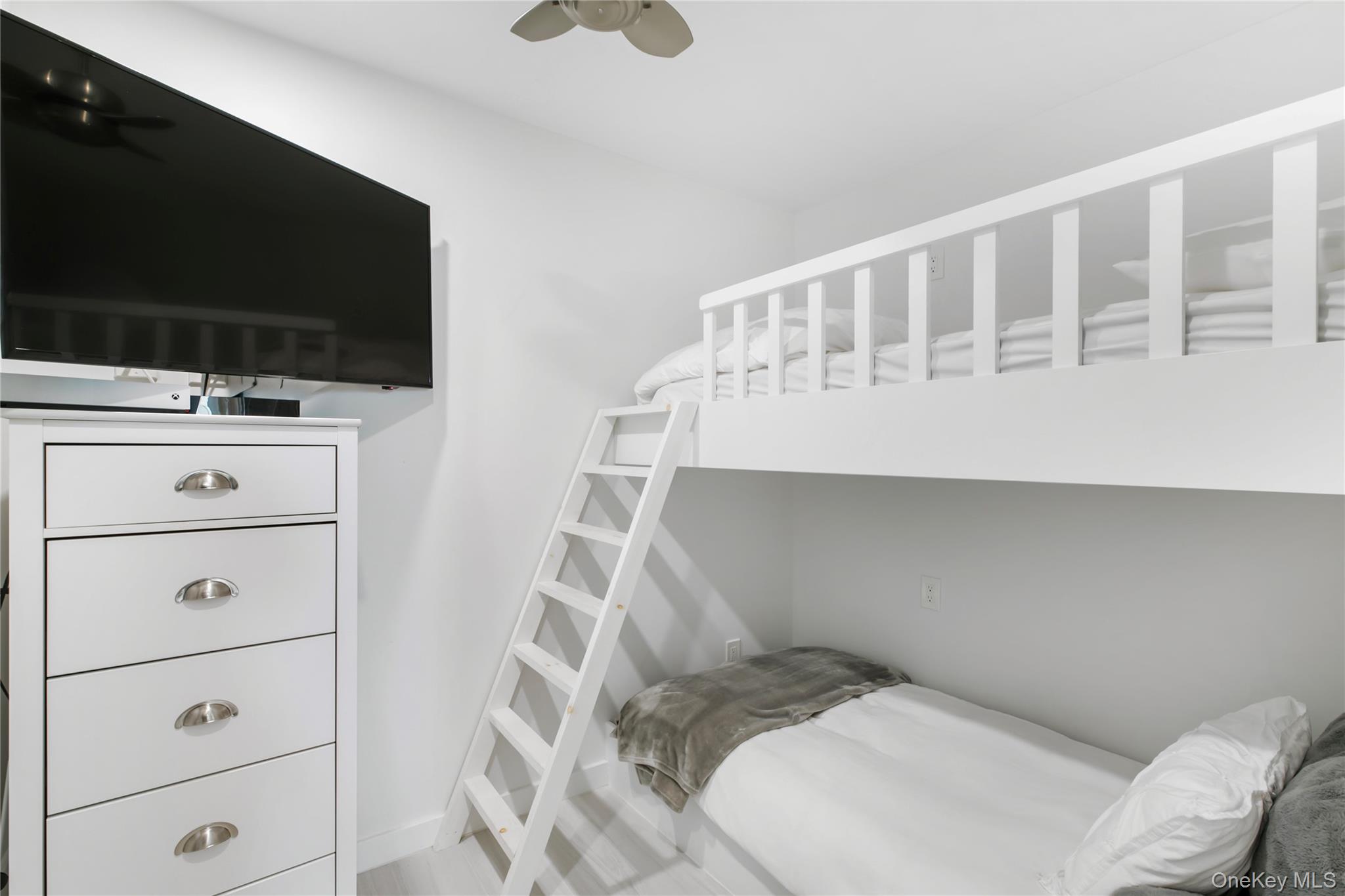 260 Dune Road, Unit 101G Westhampton Beach, NY 11978 - Photo 12 of 16 a very nice looking room with a flat screen tv
