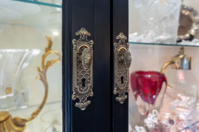 a living room with furniture a rug and a bookshelf