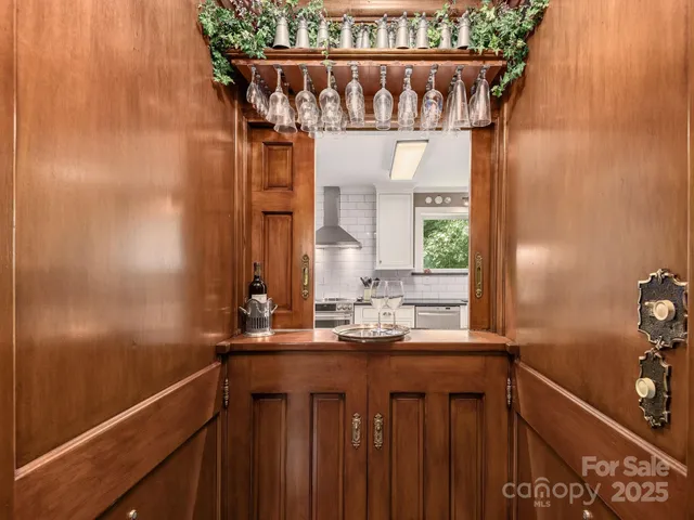 a kitchen with stainless steel appliances a refrigerator sink and cabinets