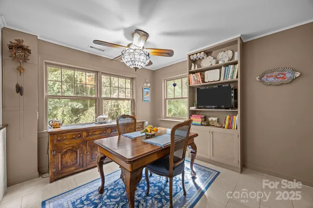 a view of a dining room with furniture window and outside view