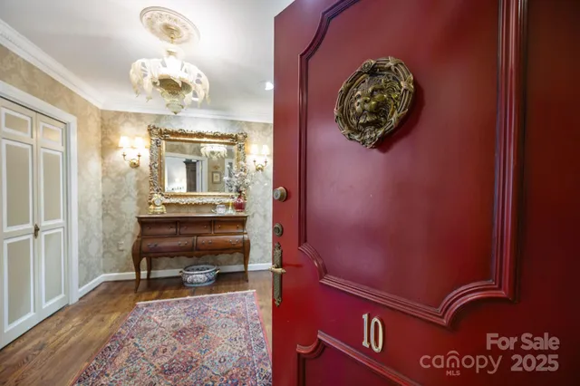 hallway with wooden floor and dining room view