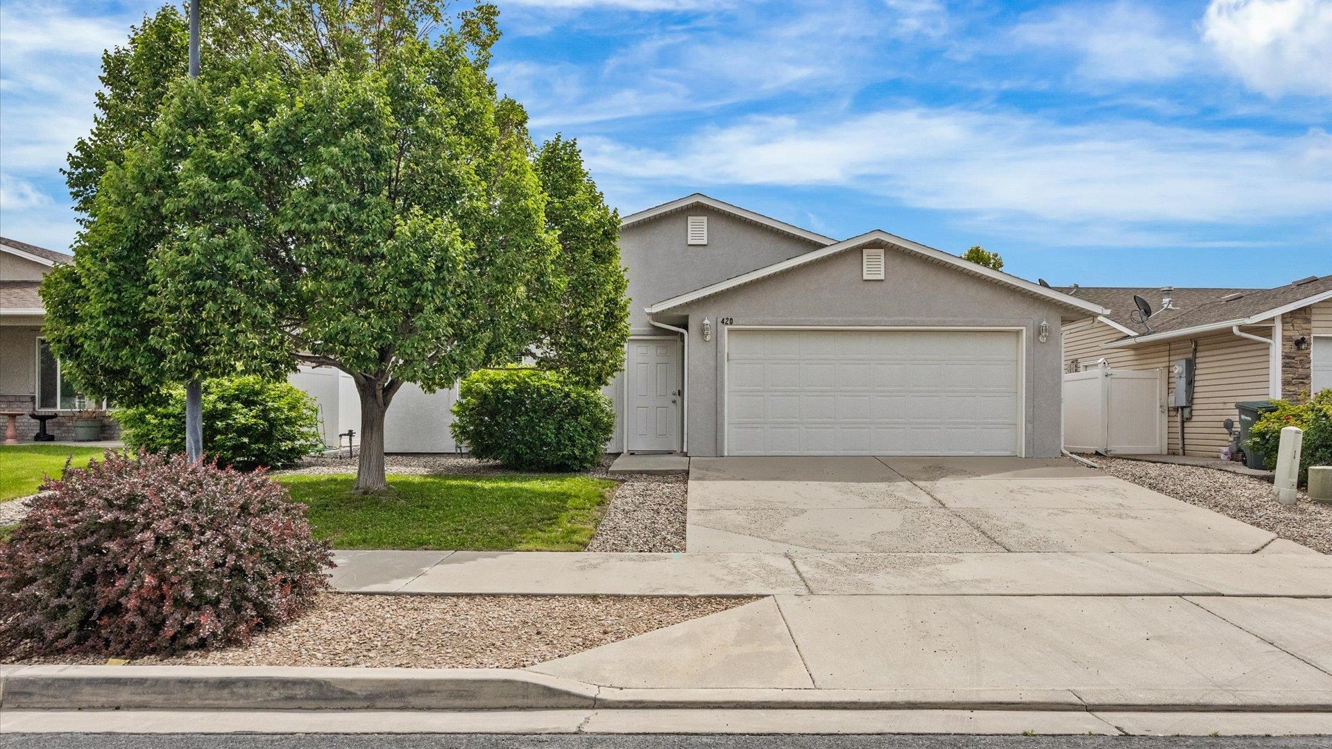 420-29 29 1/2 Road Grand Junction, CO 81504 - Photo 1 of 26 a front view of a house with a garden