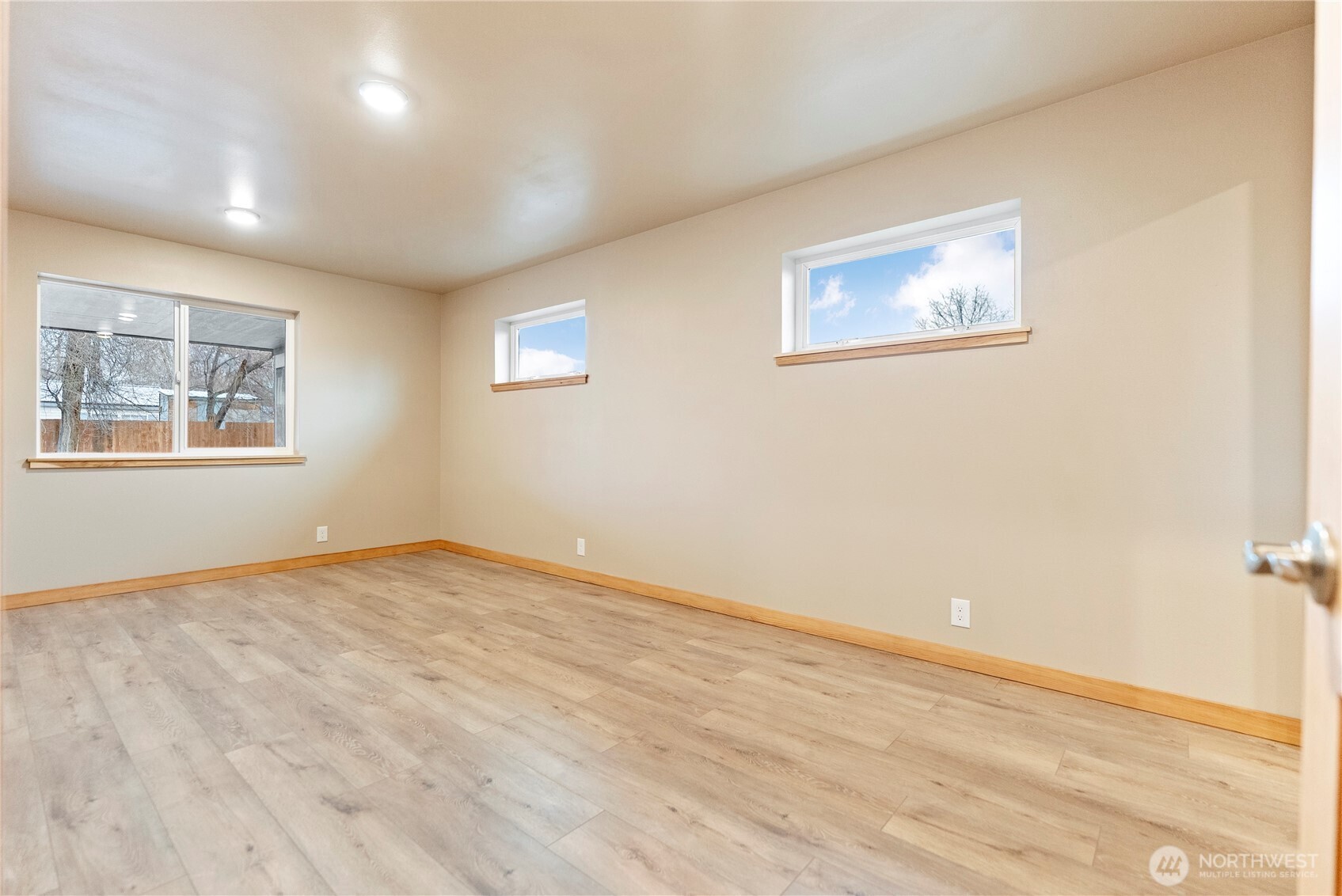 1110 Riverside Avenue Twisp, WA 98856 - Photo 15 of 28 a view of an empty room with wooden floor and a window