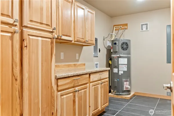 a kitchen with stainless steel appliances granite countertop a refrigerator and a window