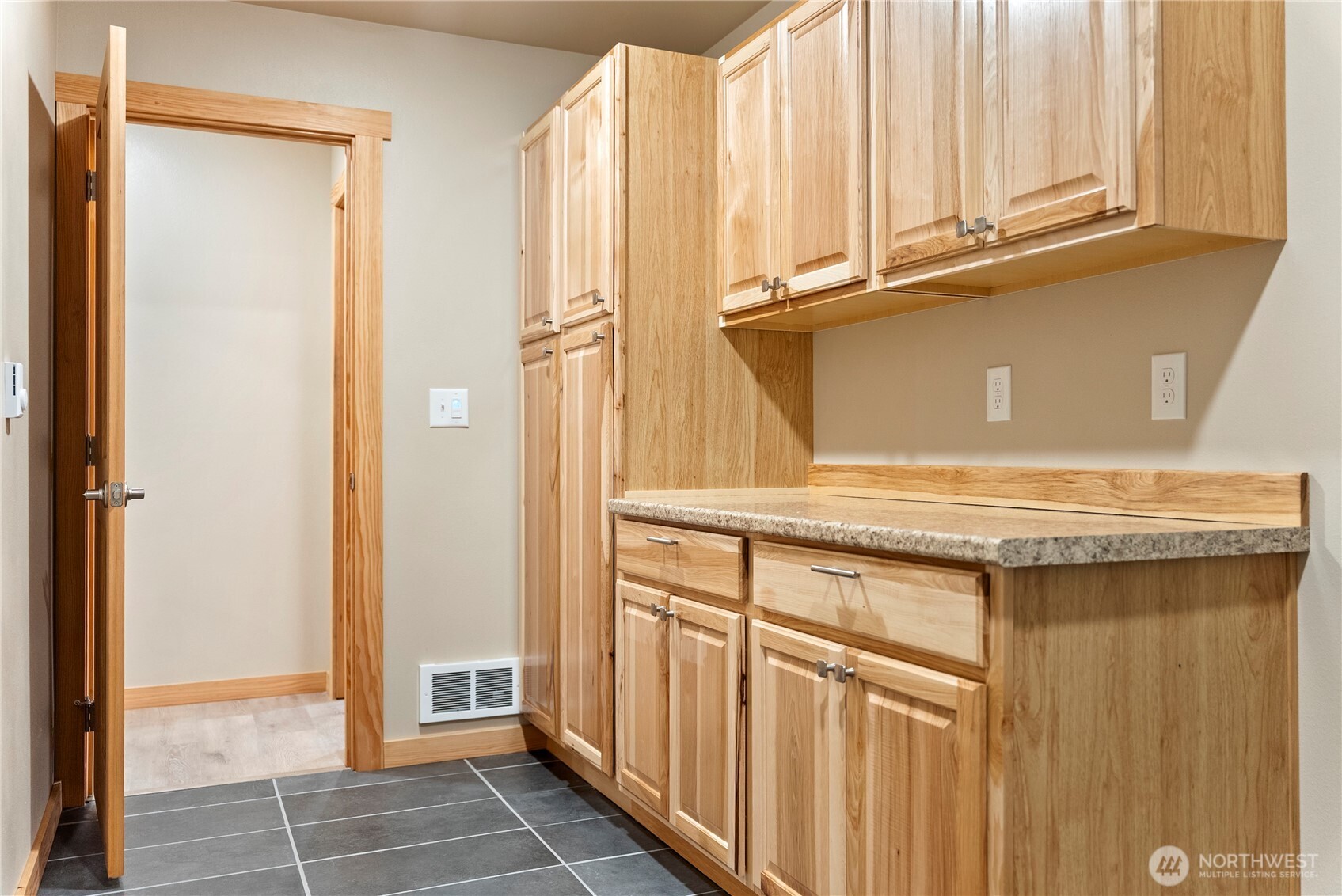 1110 Riverside Avenue Twisp, WA 98856 - Photo 25 of 28 a view of a kitchen with white cabinets and a window