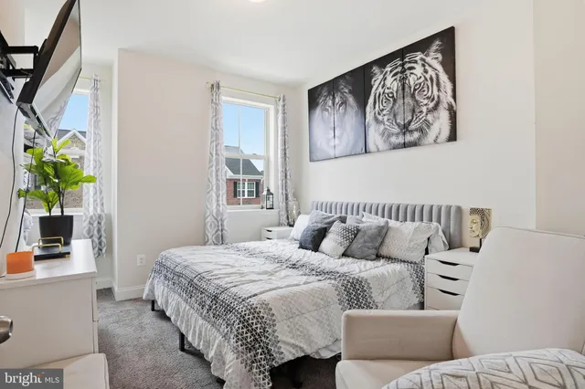 a bedroom with a large bed and a couch