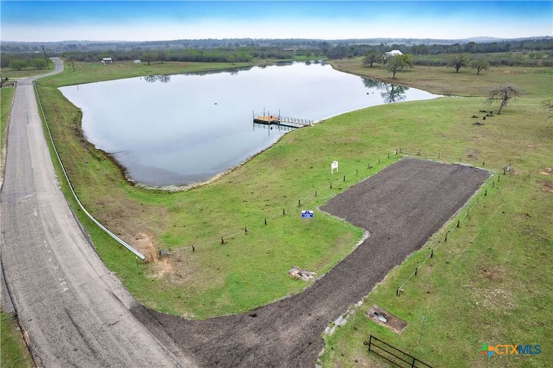 494 Flash Circle Luling, TX 78648 - Photo 41 of 44 a view of a lake with a yard