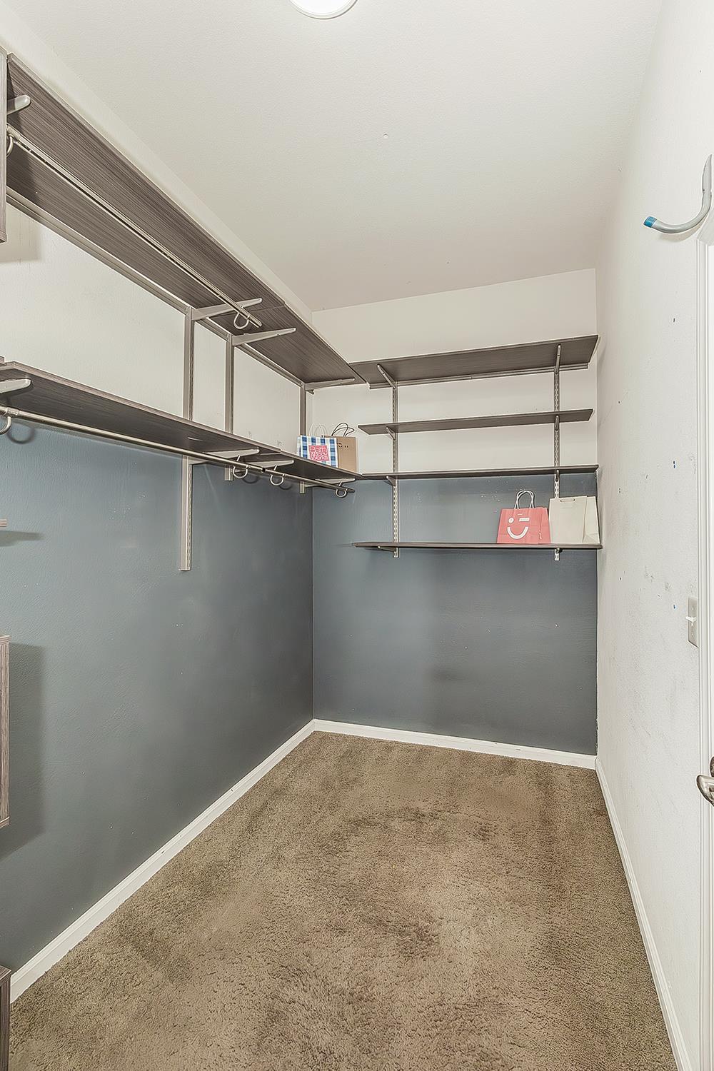 7357 East Redlands Avenue Fresno, CA 93737 - Photo 30 of 59 Primary Walk-in Closet with closet organizer