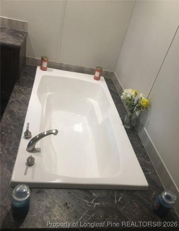 2754 Snipes Road Red Springs, NC 28377 - Photo 14 of 25 a bathroom with a bathtub