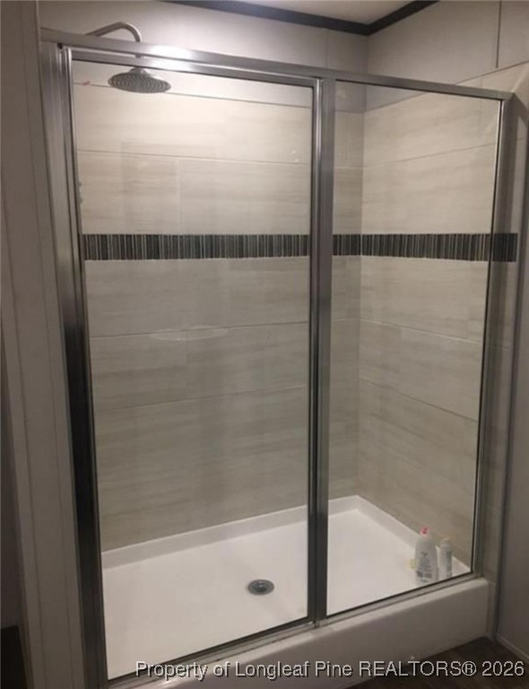 2754 Snipes Road Red Springs, NC 28377 - Photo 16 of 25 a bathroom with a glass shower door