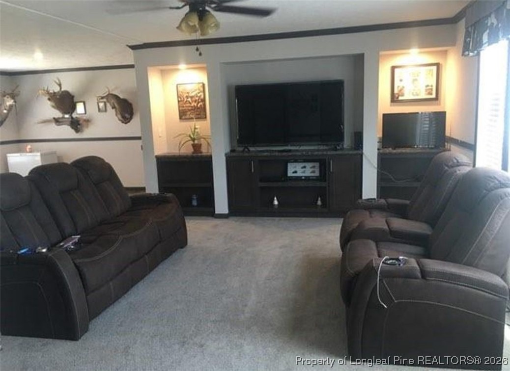 2754 Snipes Road Red Springs, NC 28377 - Photo 6 of 25 a living room with furniture and a flat screen tv