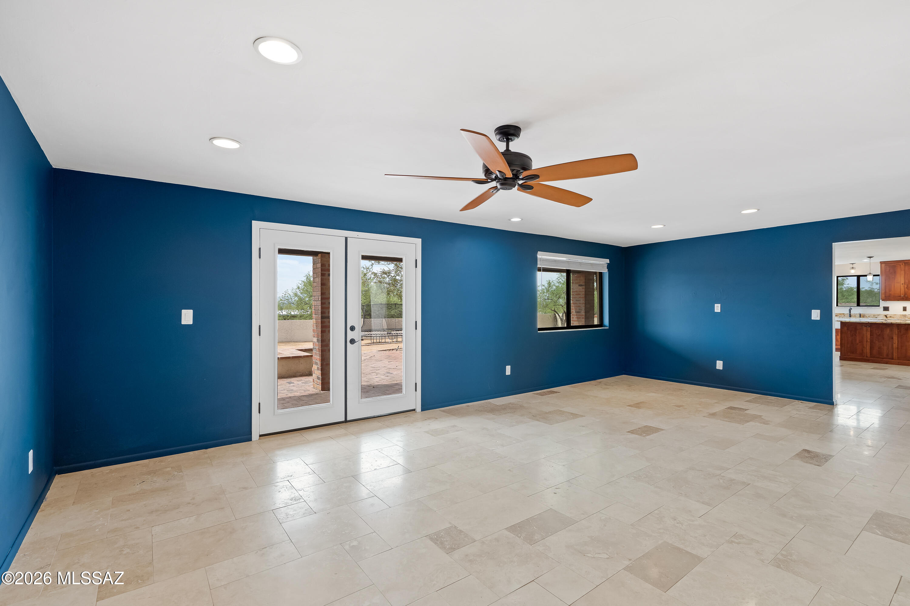 9420 East Ravine Trail Tucson, AZ 85749 - Photo 8 of 39 a view of a livingroom with a ceiling fan and window