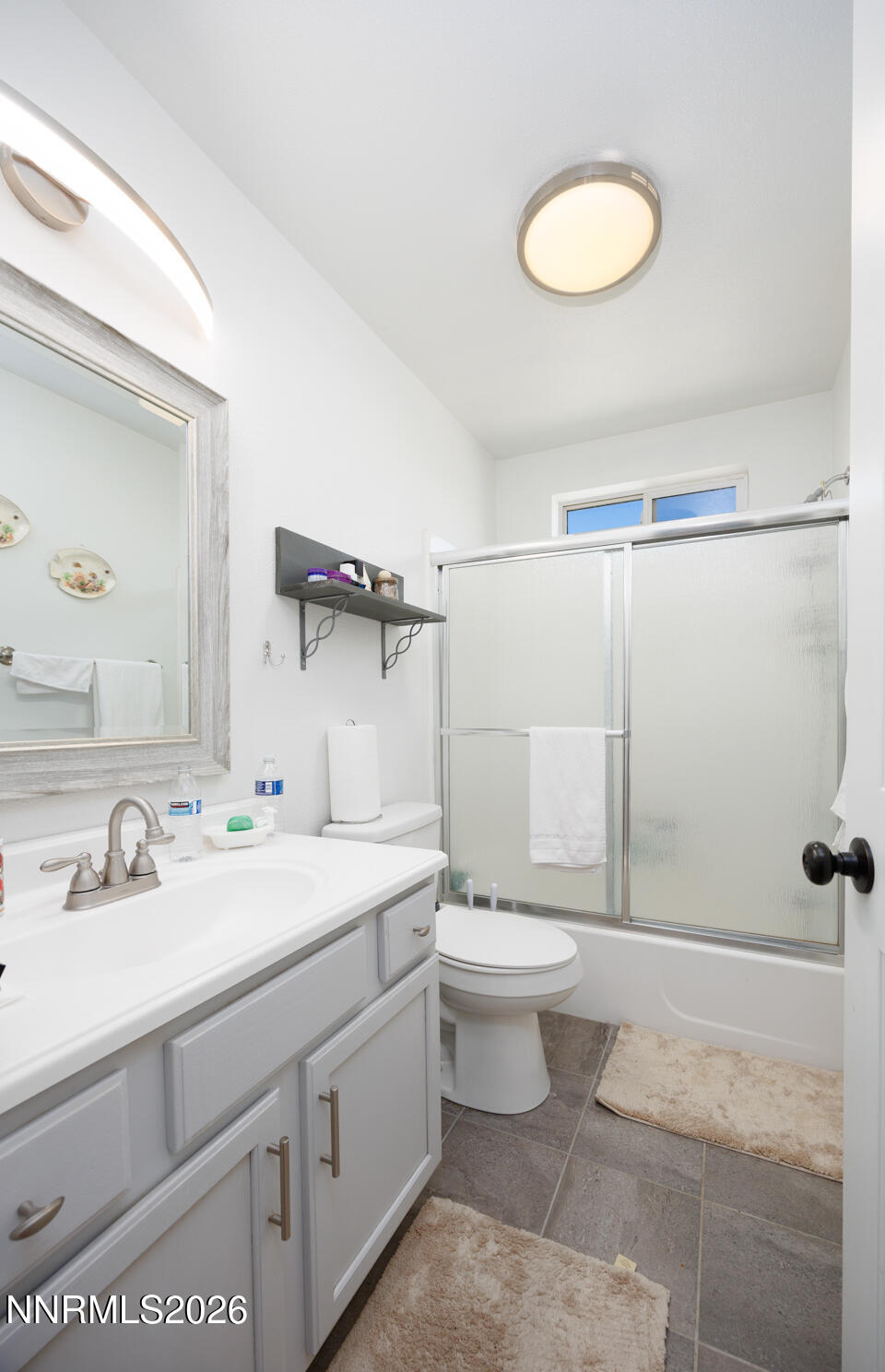 2885 Dallas Drive Fallon, NV 89406 - Photo 10 of 27 a bathroom with a sink a toilet and a mirror