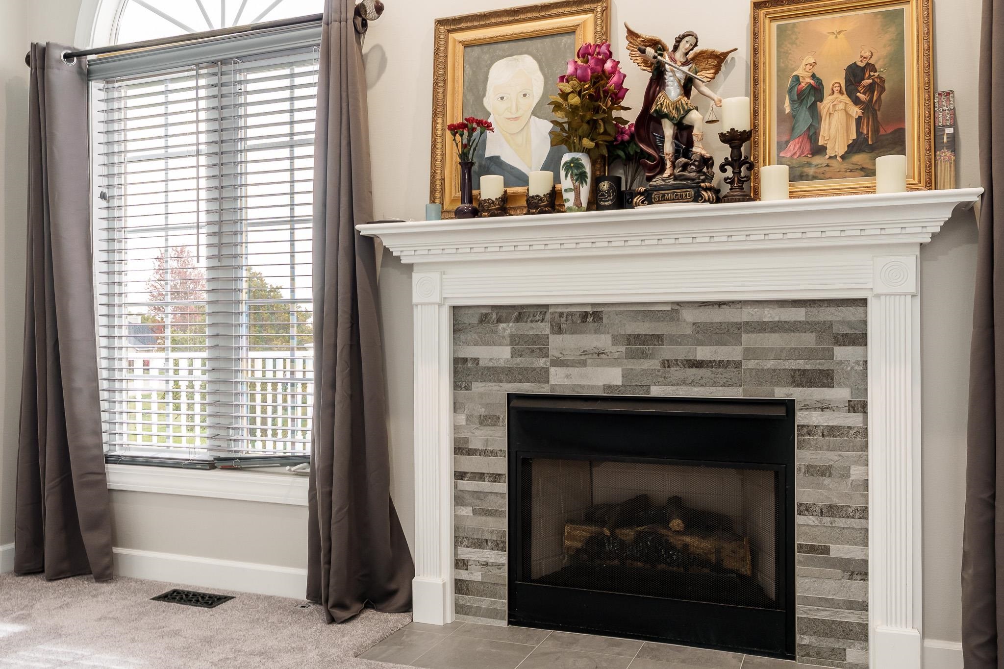 664 Elberon Way Roscoe, IL 61073 - Photo 16 of 63 a view of a fireplace in a room