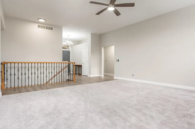 a kitchen with stainless steel appliances kitchen island granite countertop a stove and a sink