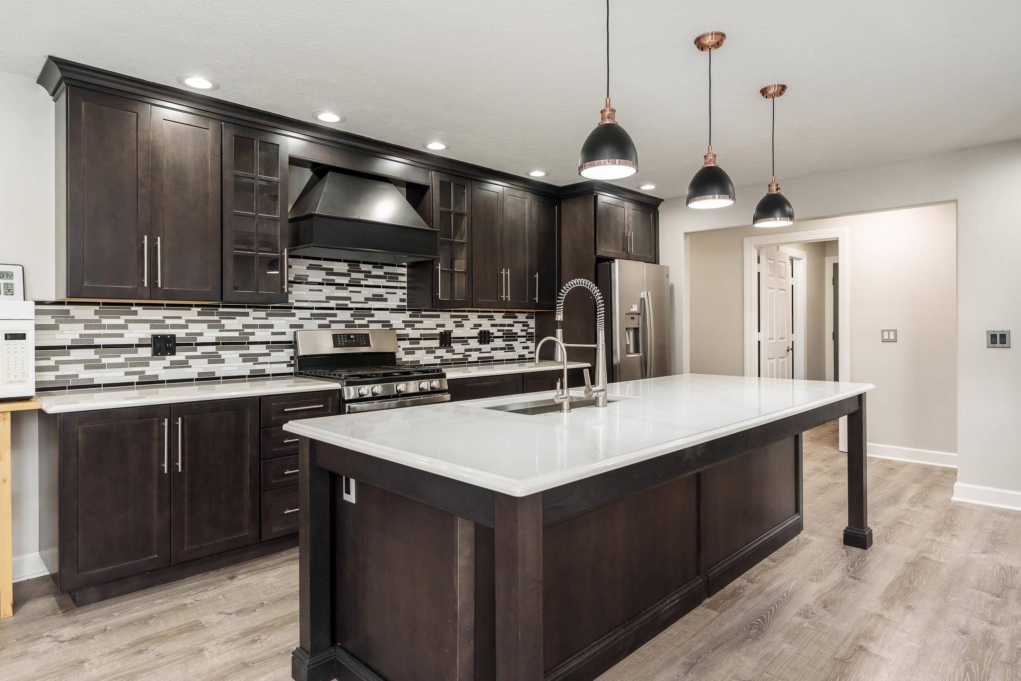 664 Elberon Way Roscoe, IL 61073 - Photo 19 of 63 a kitchen with a sink a counter space appliances and cabinets