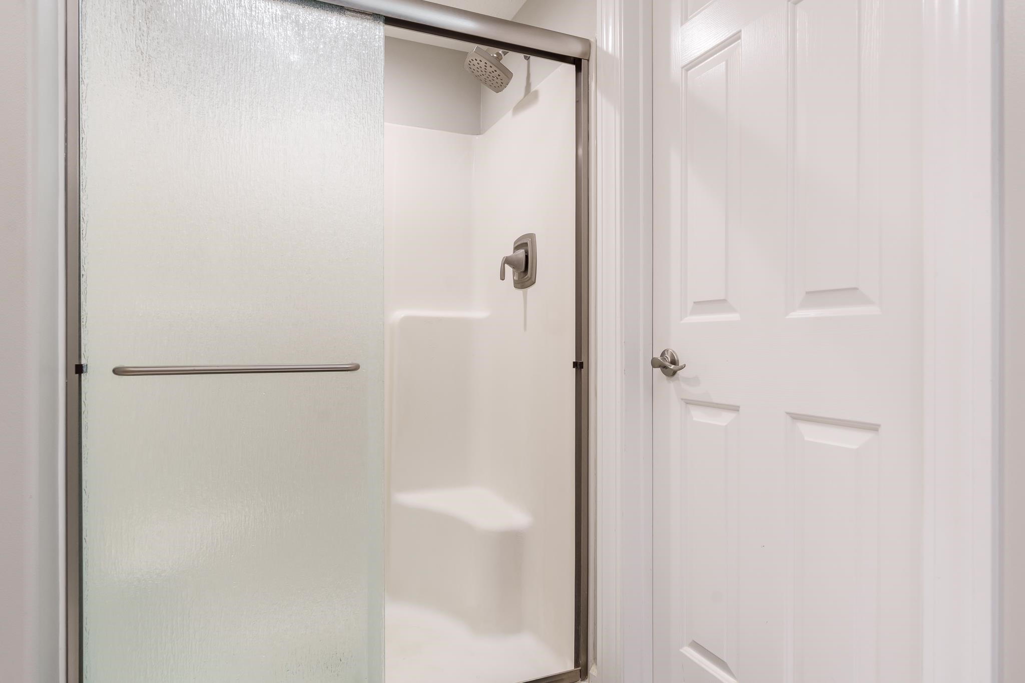 664 Elberon Way Roscoe, IL 61073 - Photo 31 of 63 a bathroom with a glass shower door