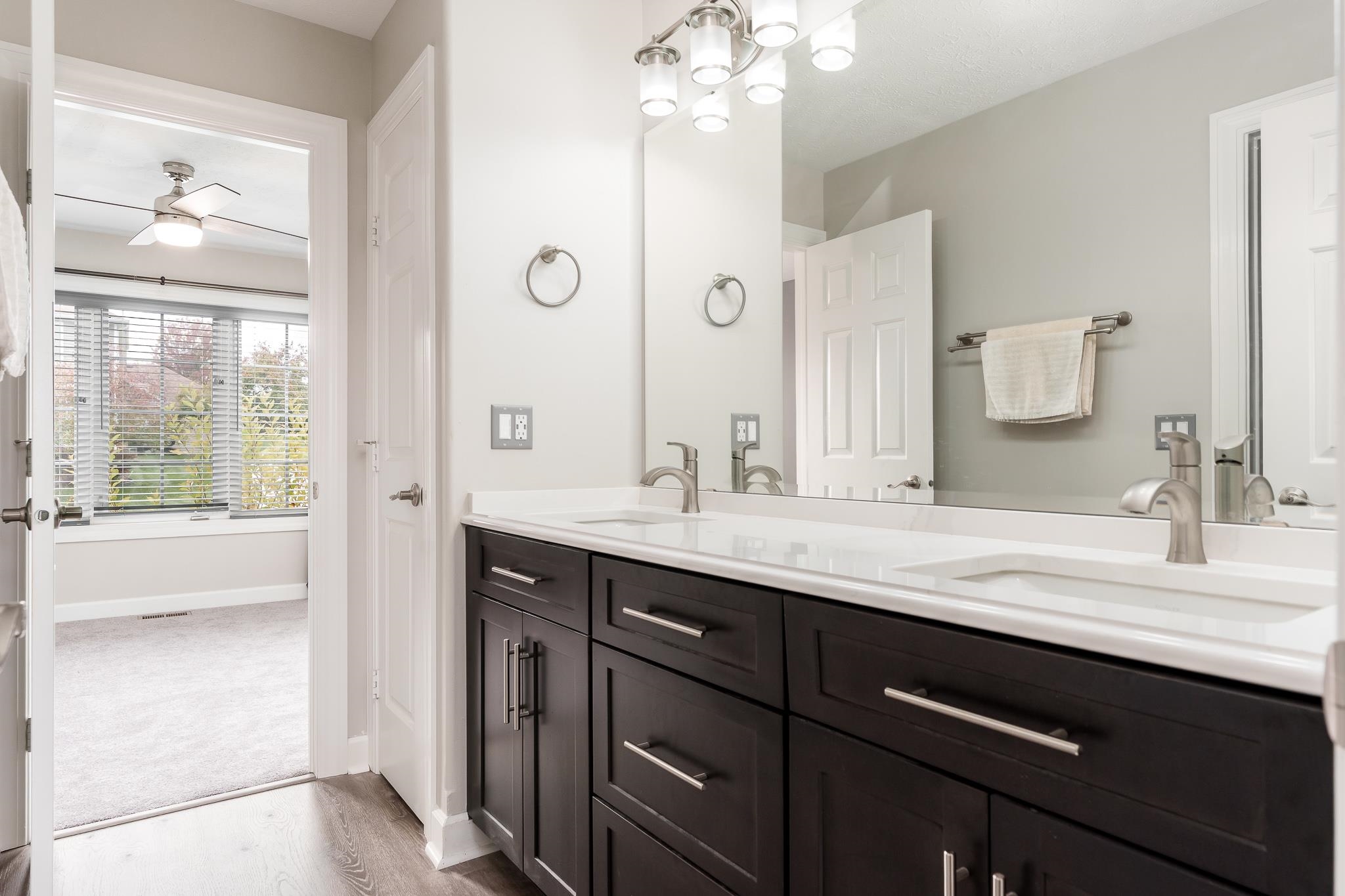 664 Elberon Way Roscoe, IL 61073 - Photo 35 of 63 a bathroom with a granite countertop sink and a mirror