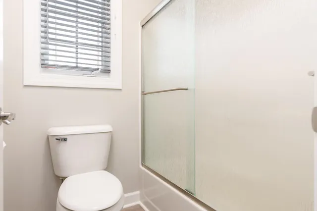 a view of an empty room with a fireplace