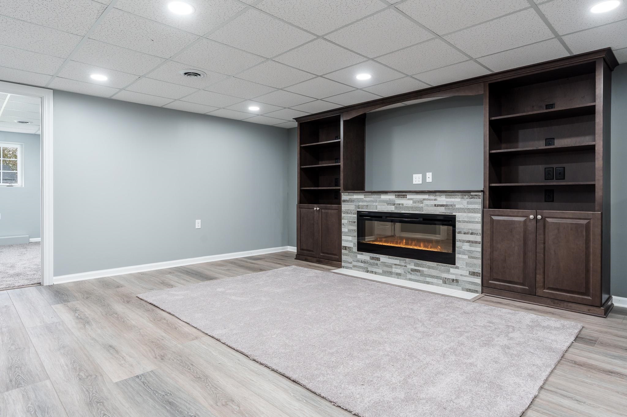 664 Elberon Way Roscoe, IL 61073 - Photo 42 of 63 a view of an empty room with a fireplace