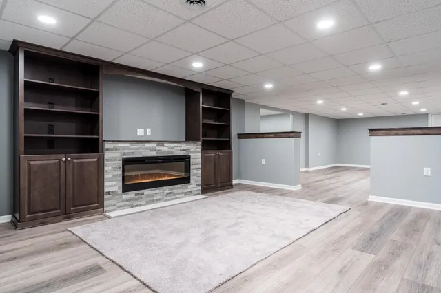 a room with a window and wooden floor