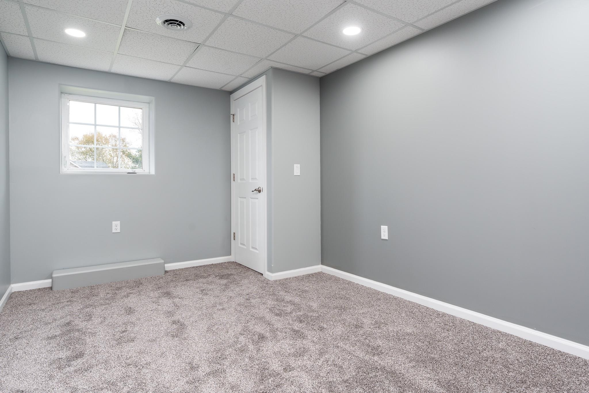 664 Elberon Way Roscoe, IL 61073 - Photo 45 of 63 an empty room with a empty space and windows