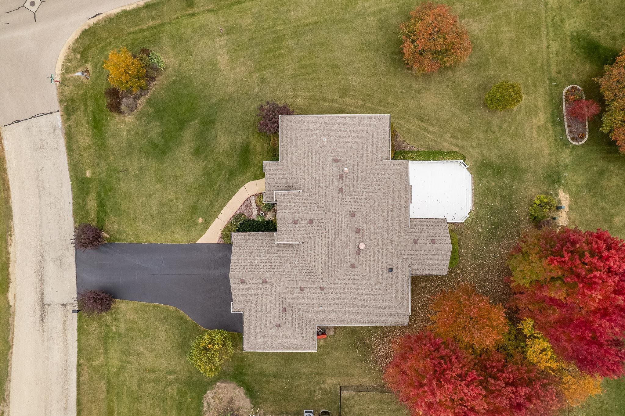 664 Elberon Way Roscoe, IL 61073 - Photo 59 of 63 an aerial view of a house with a yard