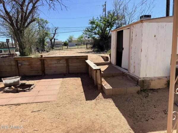 a view of a backyard of the house