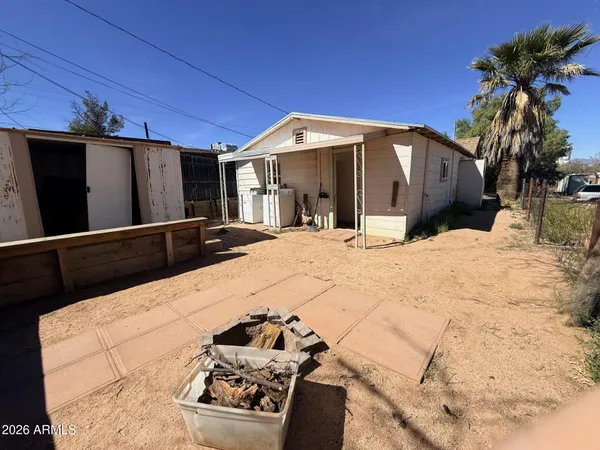a view of a house with a snow in the background