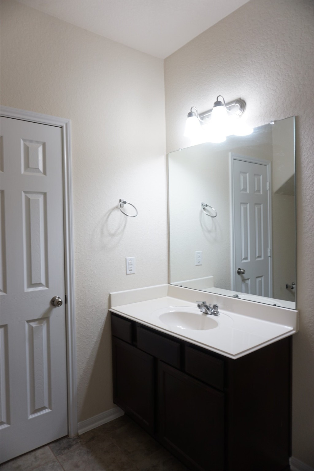 10615 North Chestnut Street Tomball, TX 77375 - Photo 13 of 15 a bathroom with a sink and a mirror