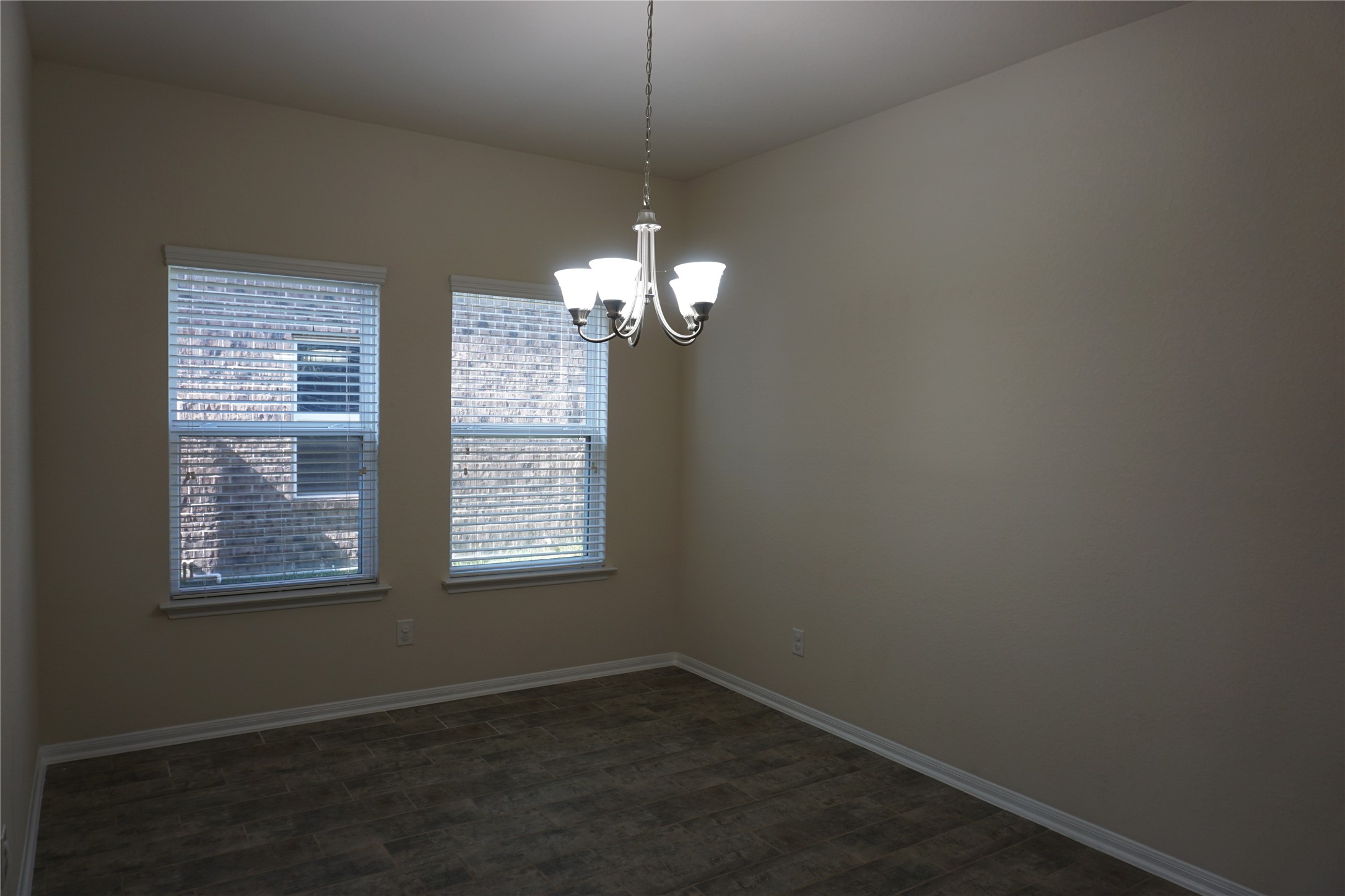 10615 North Chestnut Street Tomball, TX 77375 - Photo 5 of 15 a view of a windows and chandelier in a room