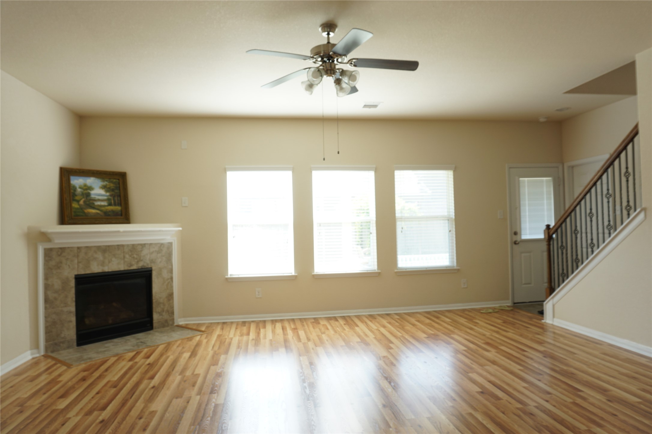 10615 North Chestnut Street Tomball, TX 77375 - Photo 7 of 15 a view of an empty room with a fireplace and a window