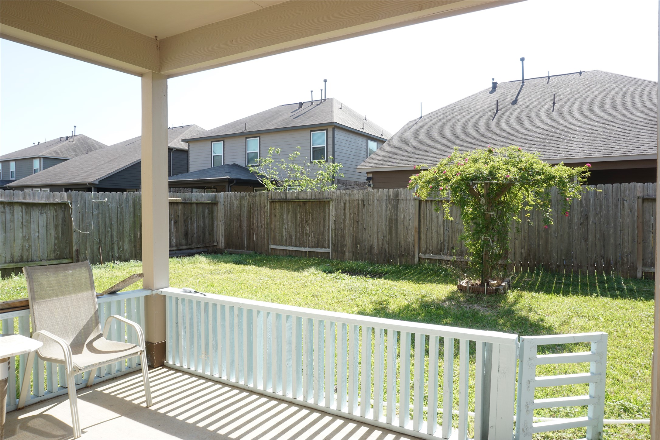 10615 North Chestnut Street Tomball, TX 77375 - Photo 10 of 15 a view of a chair and table in the backyard