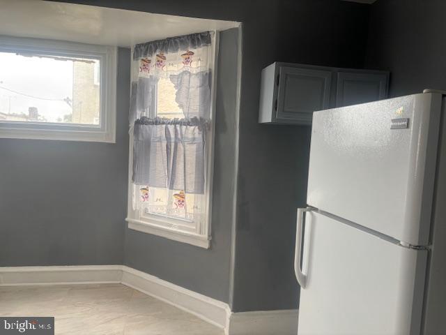 5630 Walnut Street, Unit 2 Philadelphia, PA 19139 - Photo 19 of 28 a white refrigerator freezer and a window