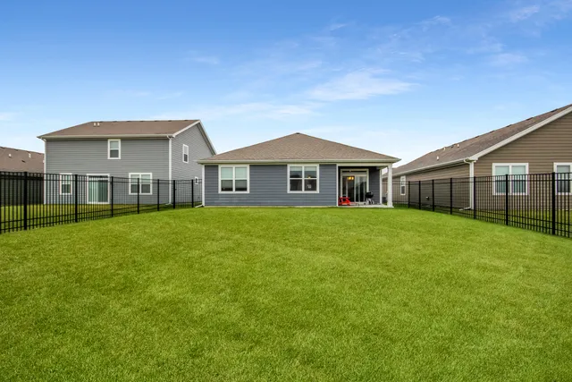 a front view of a house with a garden and porch