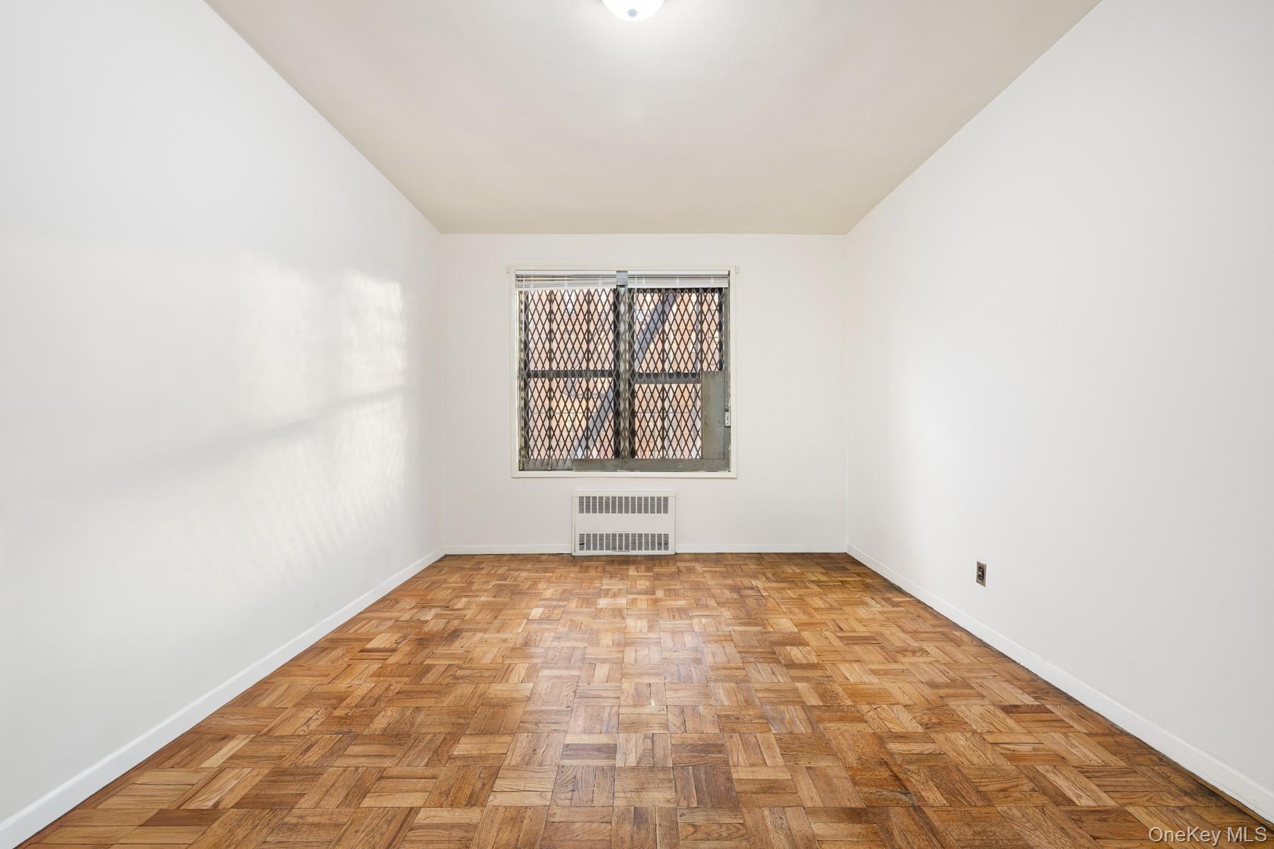 3130 Grand Concourse, Unit 2J Bronx, NY 10458 - Photo 18 of 27 an empty room with a window
