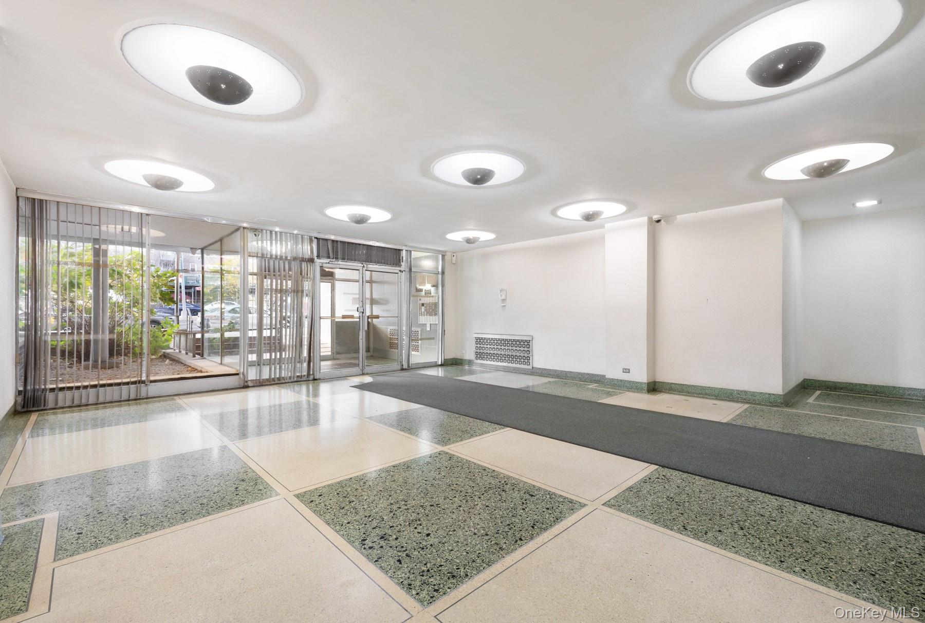 3130 Grand Concourse, Unit 2J Bronx, NY 10458 - Photo 23 of 27 a view of a hall way with furniture