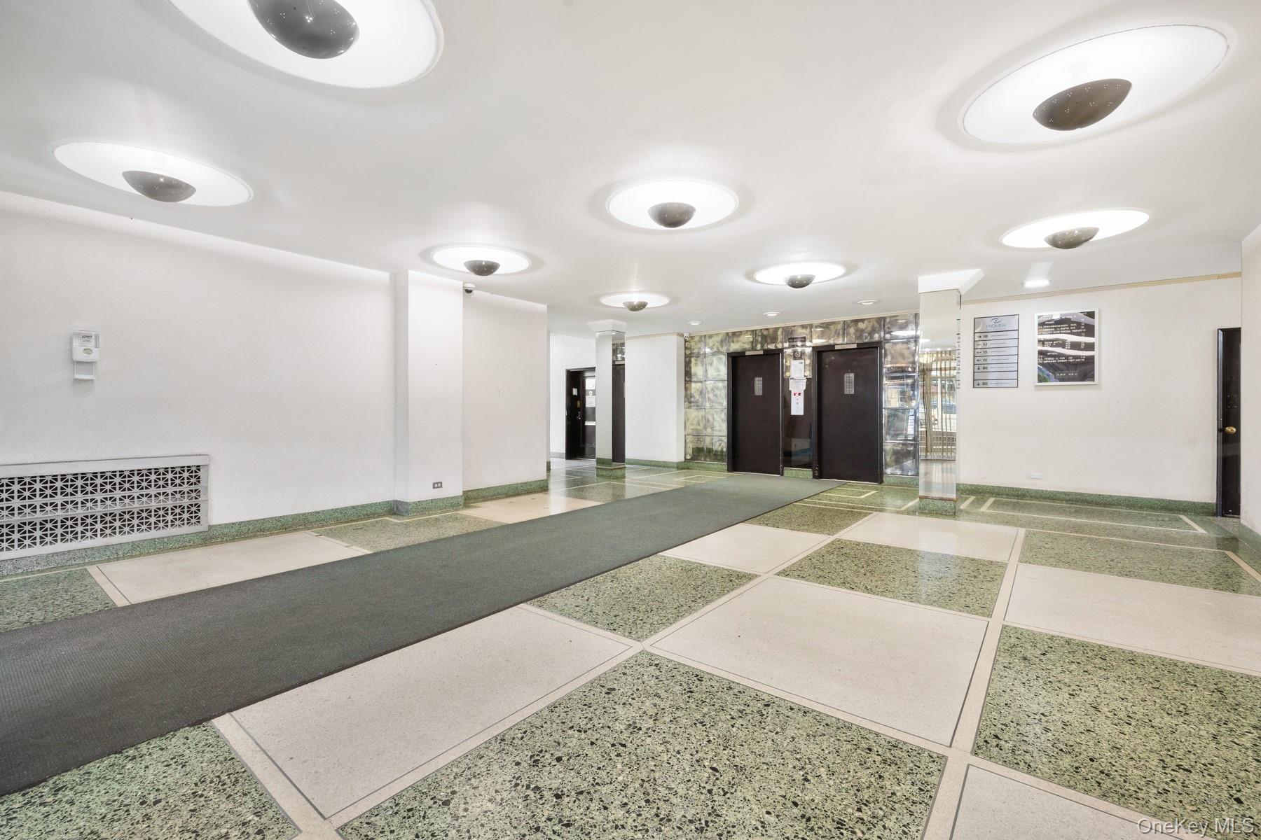 3130 Grand Concourse, Unit 2J Bronx, NY 10458 - Photo 24 of 27 a bathroom with a sink and a mirror