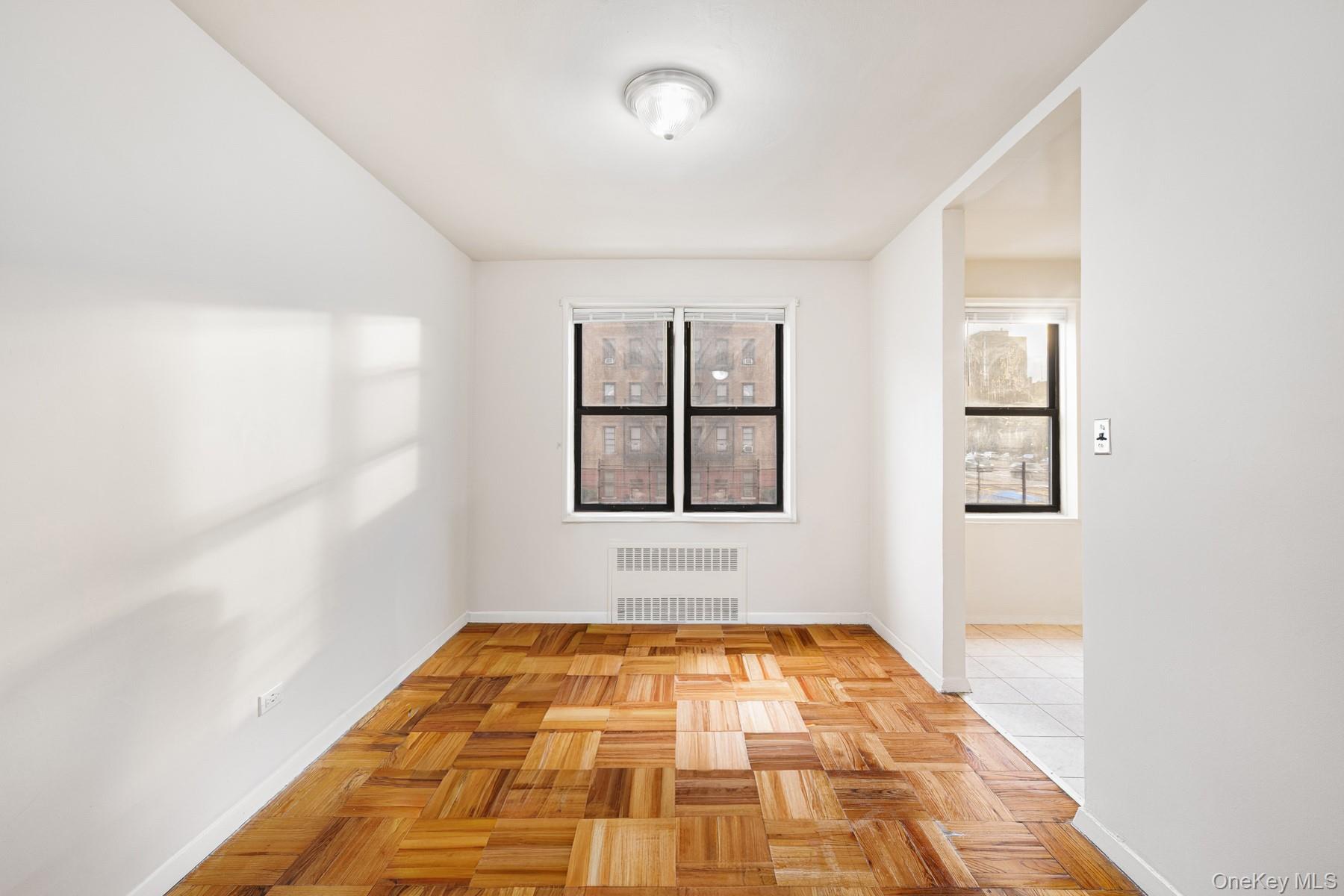 3130 Grand Concourse, Unit 2J Bronx, NY 10458 - Photo 8 of 27 a view of empty room with windows