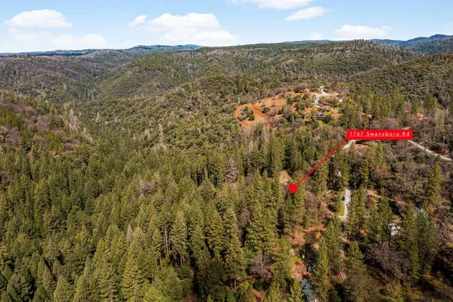 a view of a house with a street